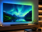 Televisão Ambilight Philips com tecnologia ligada projetando luzes coloridas em parede clara de sala moderna