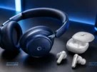 Dispositivos de audio do tipo melhores fones de ouvido da linha anker soundcore organizados sobre mesa moderna de escritorio